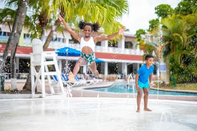 Kids playing by the pool at Holiday Inn Montego Bay