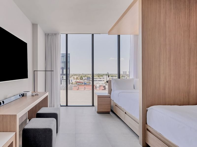 Beds & city view in Play Room, 2 double at IOH Freestyle Hotels