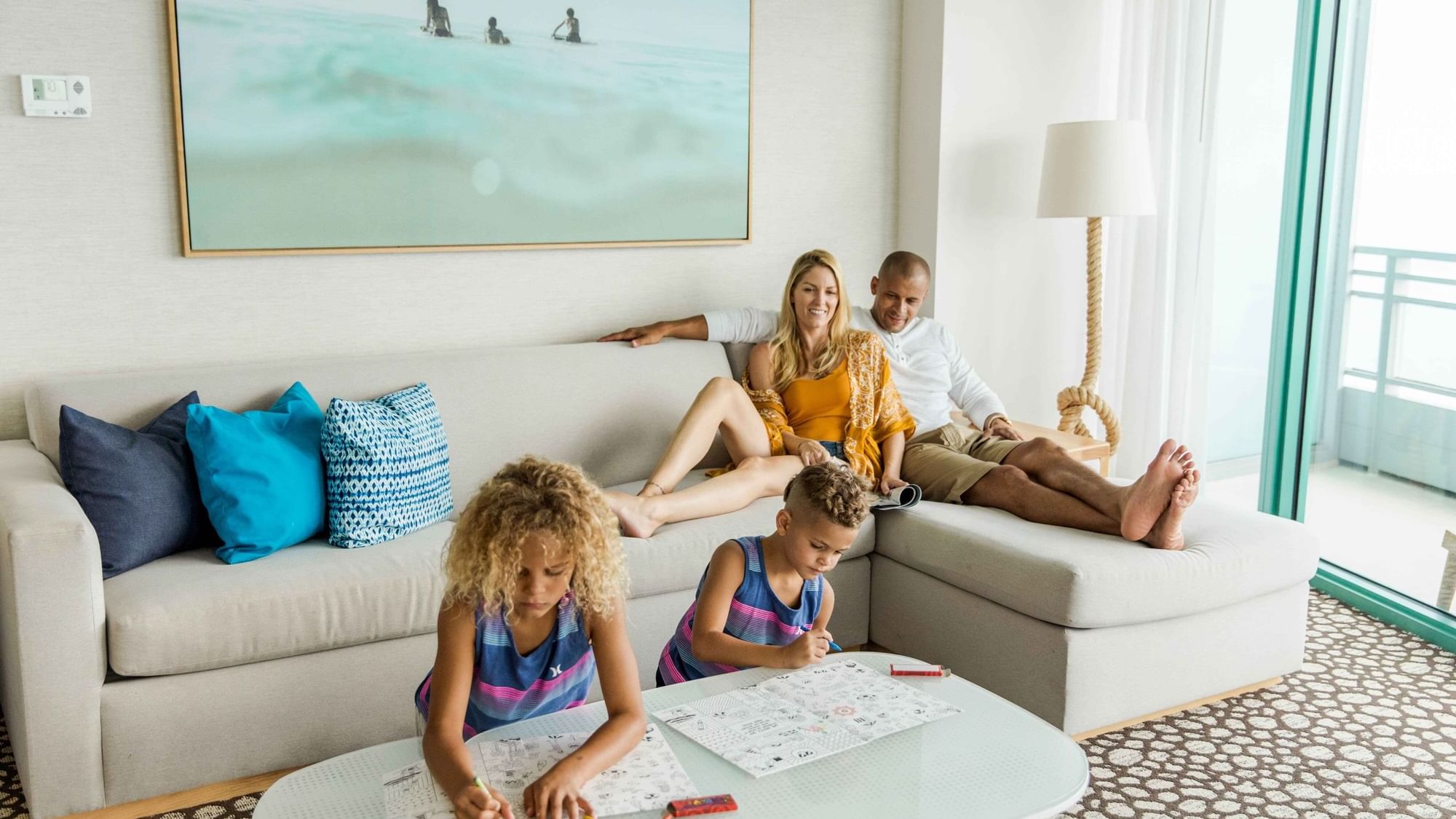 Family relaxing in Two Bedroom Family Suite at Diplomat Beach Resort