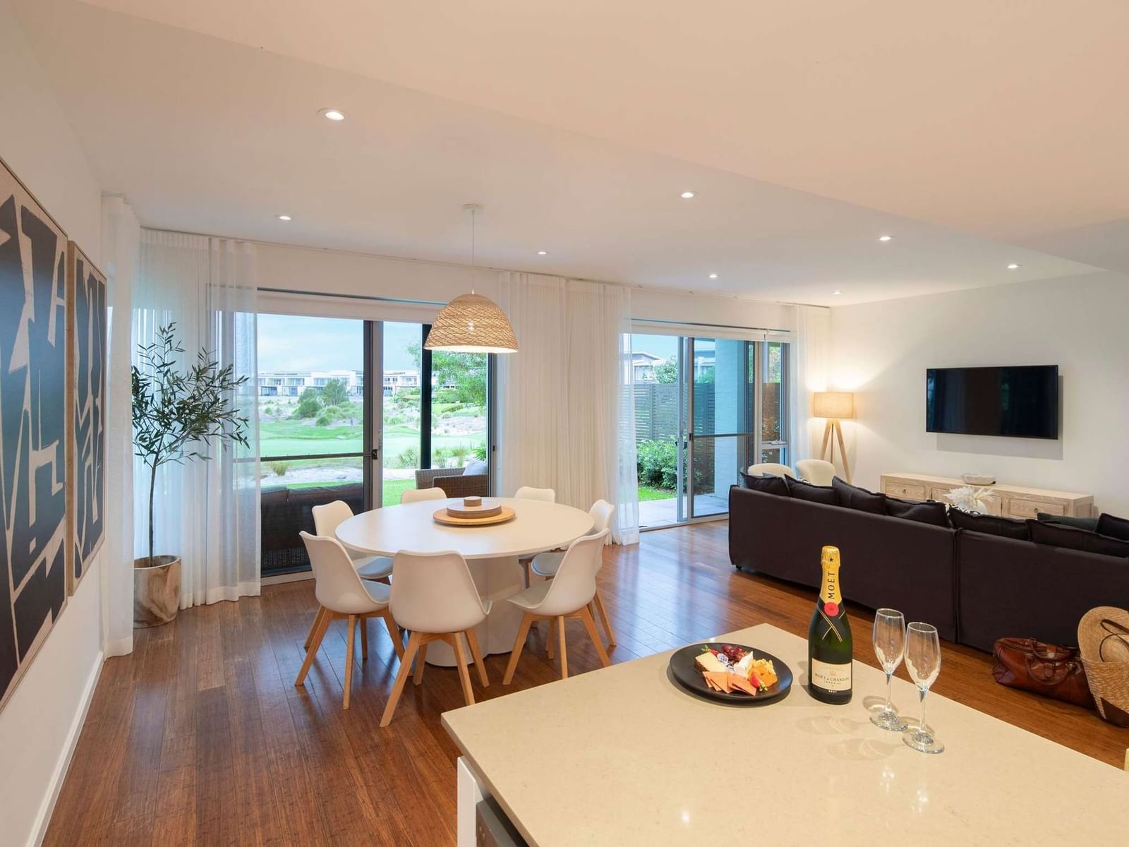 4-bedroom villa living and dining area with golf course views at Pullman Magenta Shores, ideal for entertaining