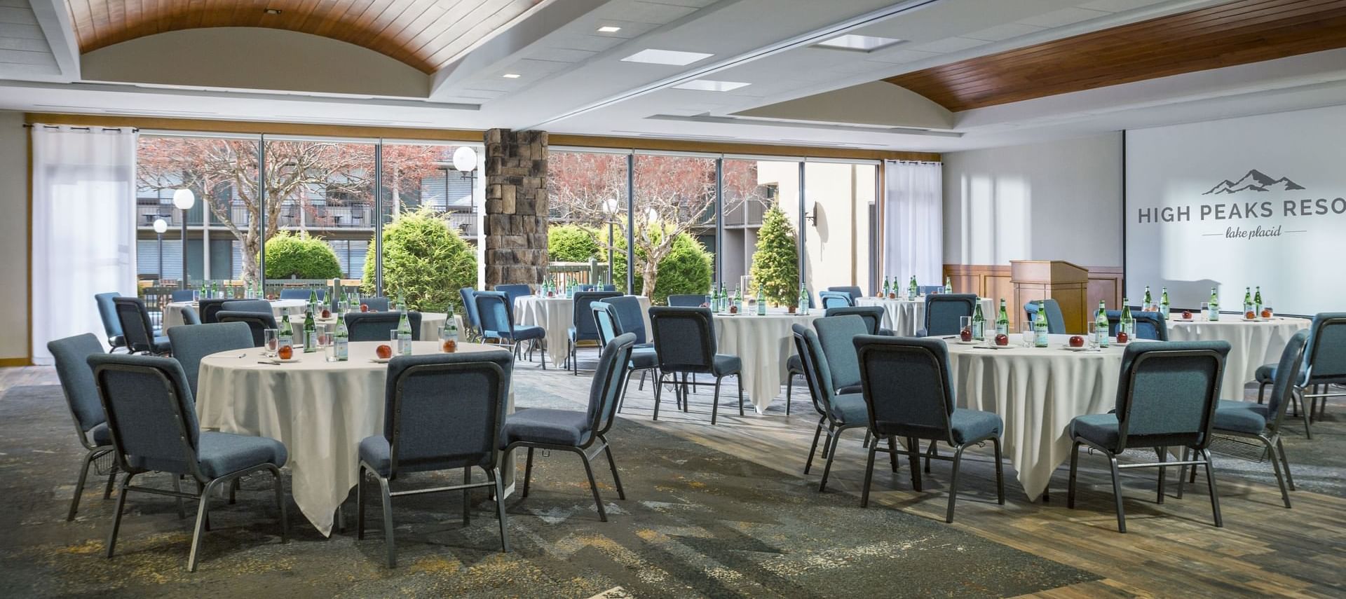 Banquet table arrangements with chairs elegantly for an event in Great Range Banquet at High Peaks Resort