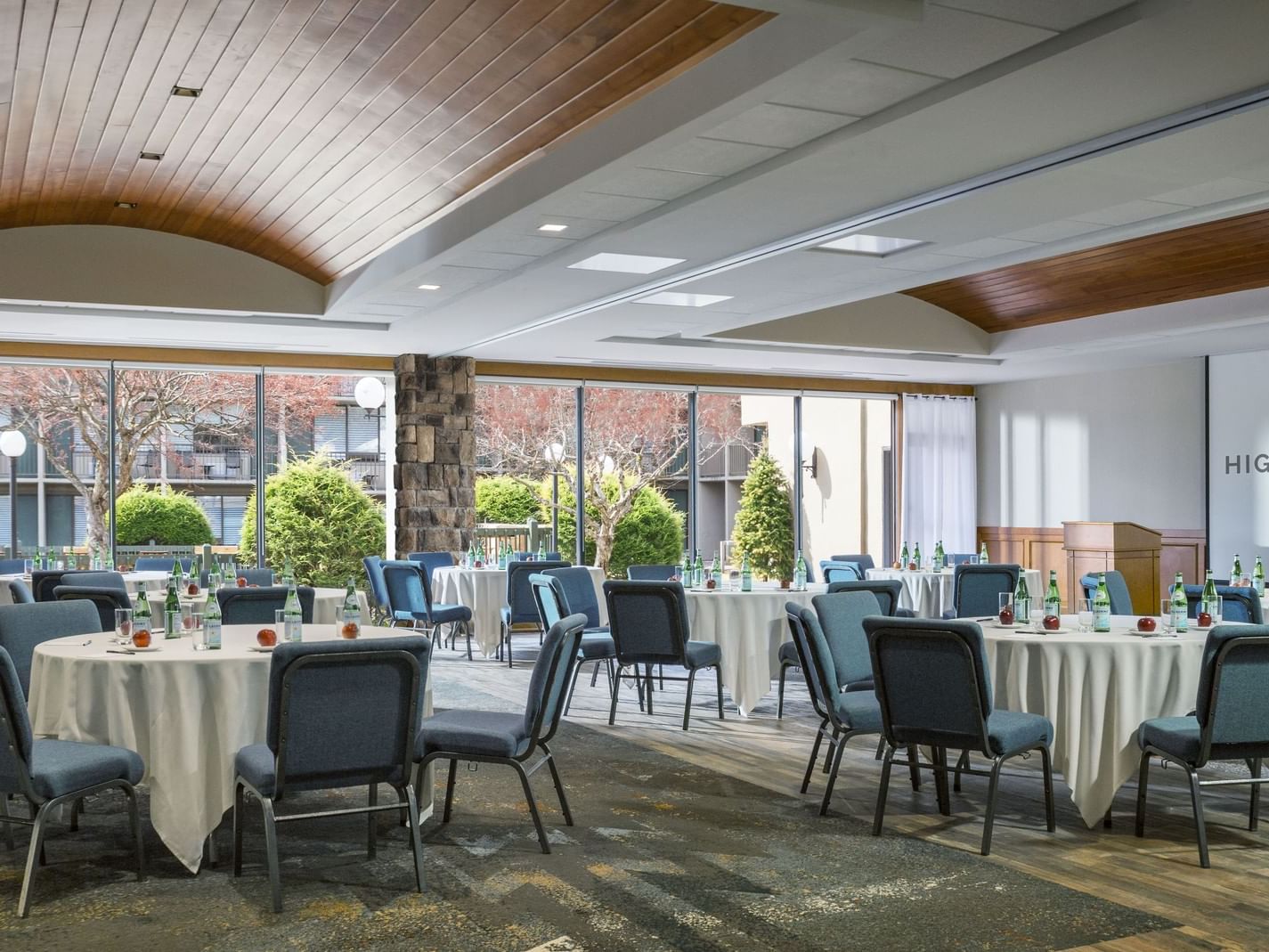 Arranged dining tables with cutlery in a restaurant at High Peaks Resort