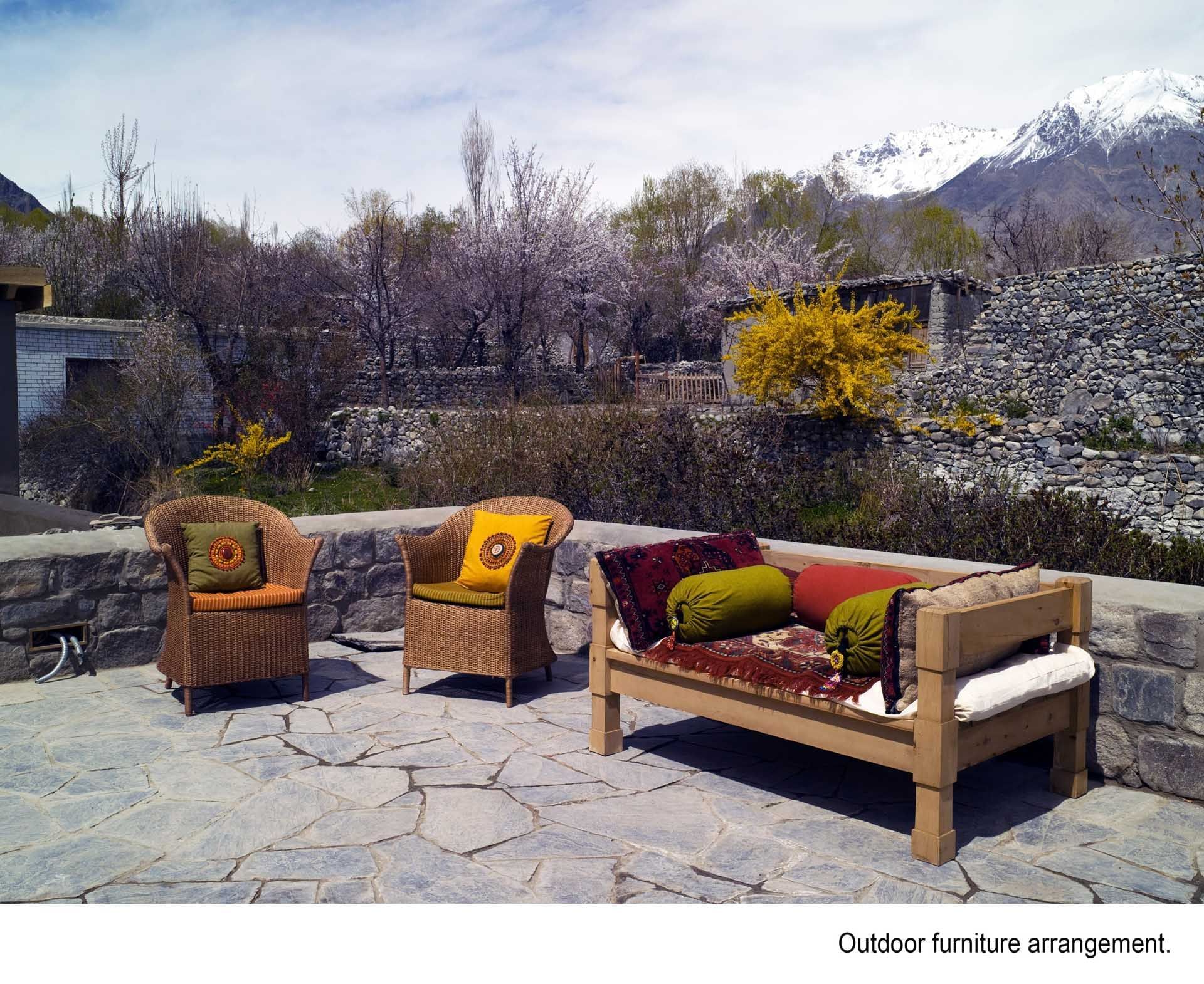 An outdoor lounge area in the hotel at Serena Khaplu Palace