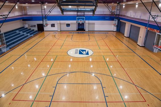 An indoor basketball court at NCED Hotel and Conference Center