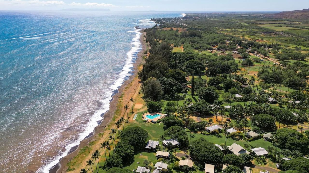 Aerial view of a Waimea Plantation Cottages with trees, and a swimming pool