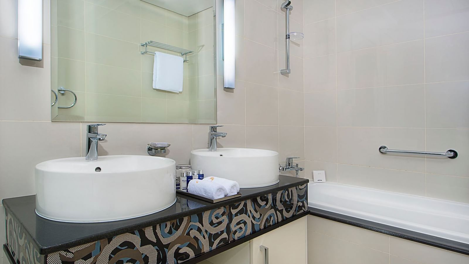 Bathroom vanity and bath rub in One Bedroom Suite at DAMAC Maison Dubai Mall Street