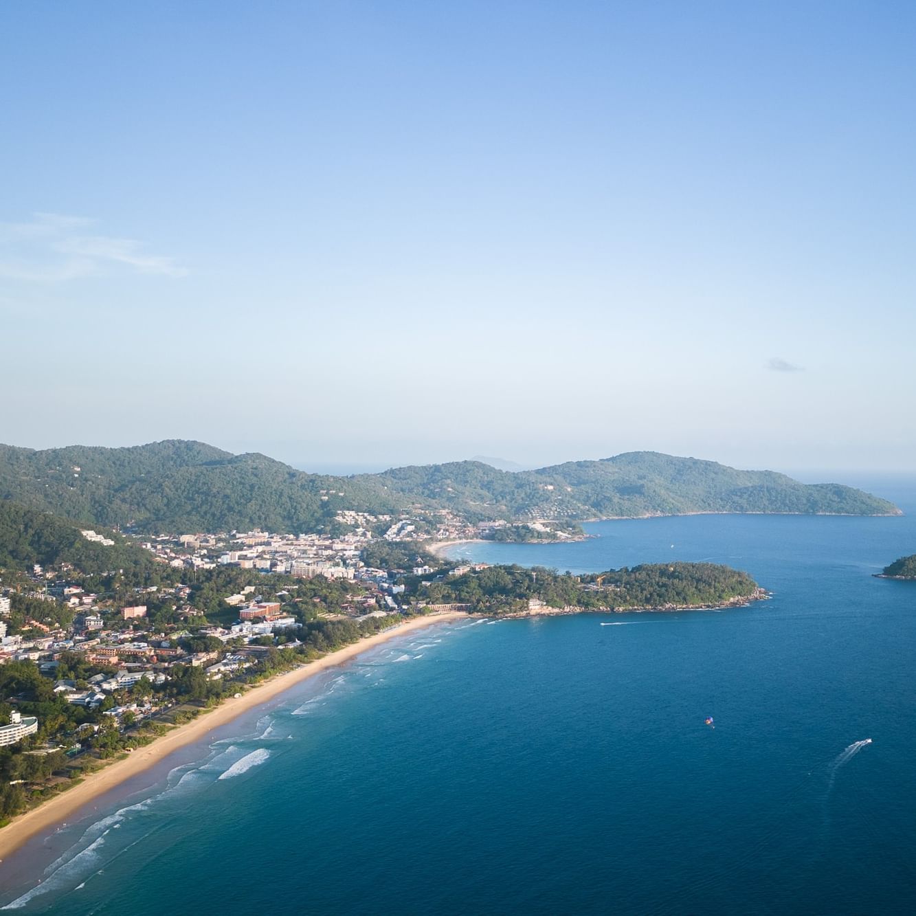 A view of one of Phuket Beaches - Karon Beach - with blue sky and blue sea