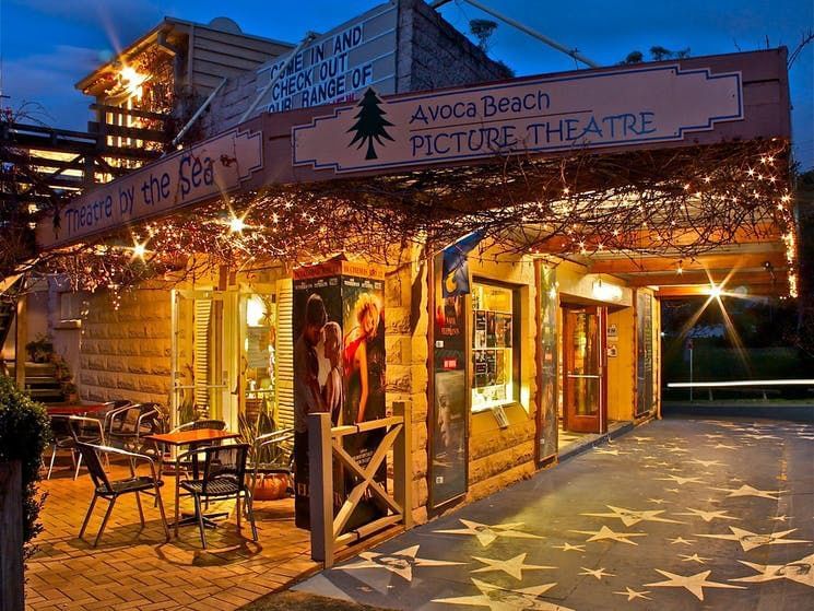 Exterior view of Avoca Beach Theatre at night near Pullman Magenta Shores