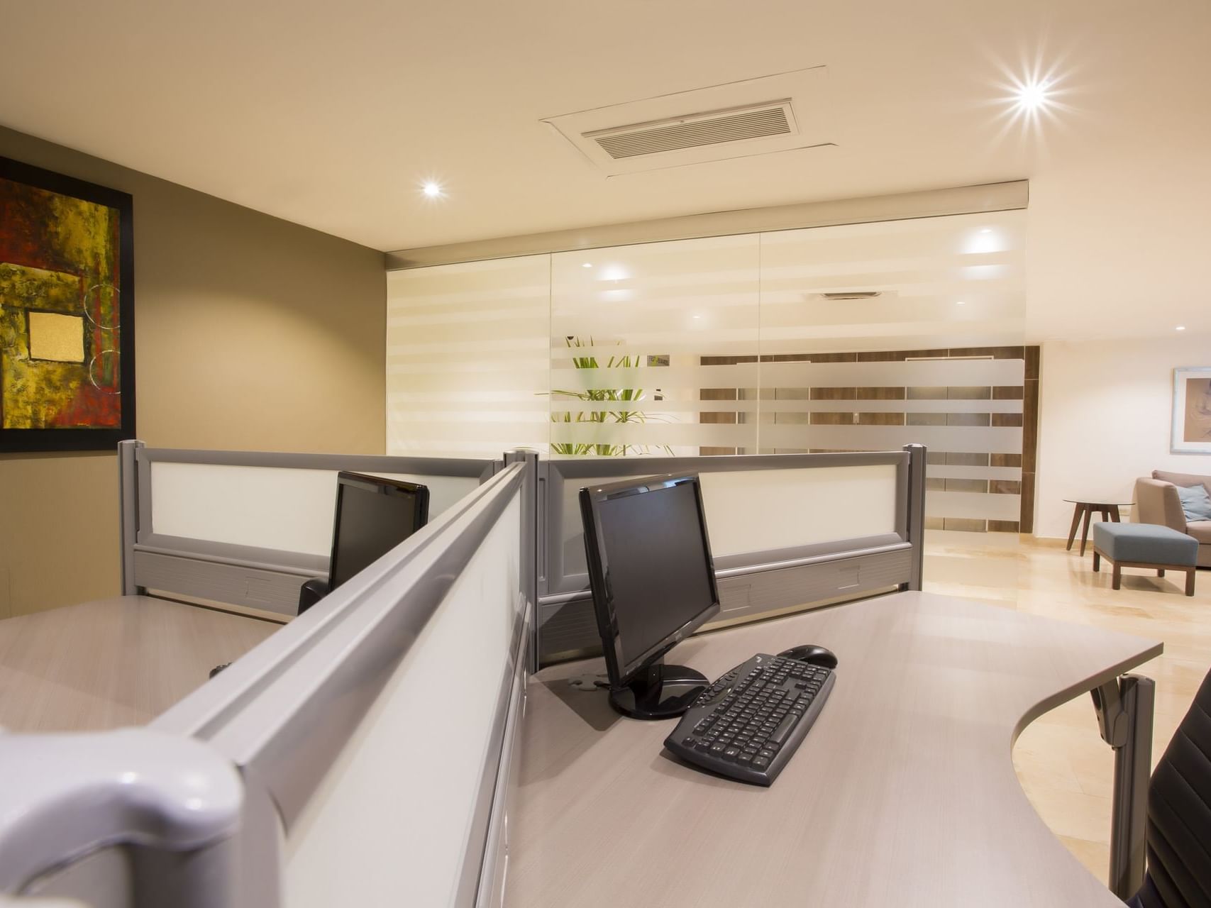 Desks & computers in a Business center at Gamma Hotels