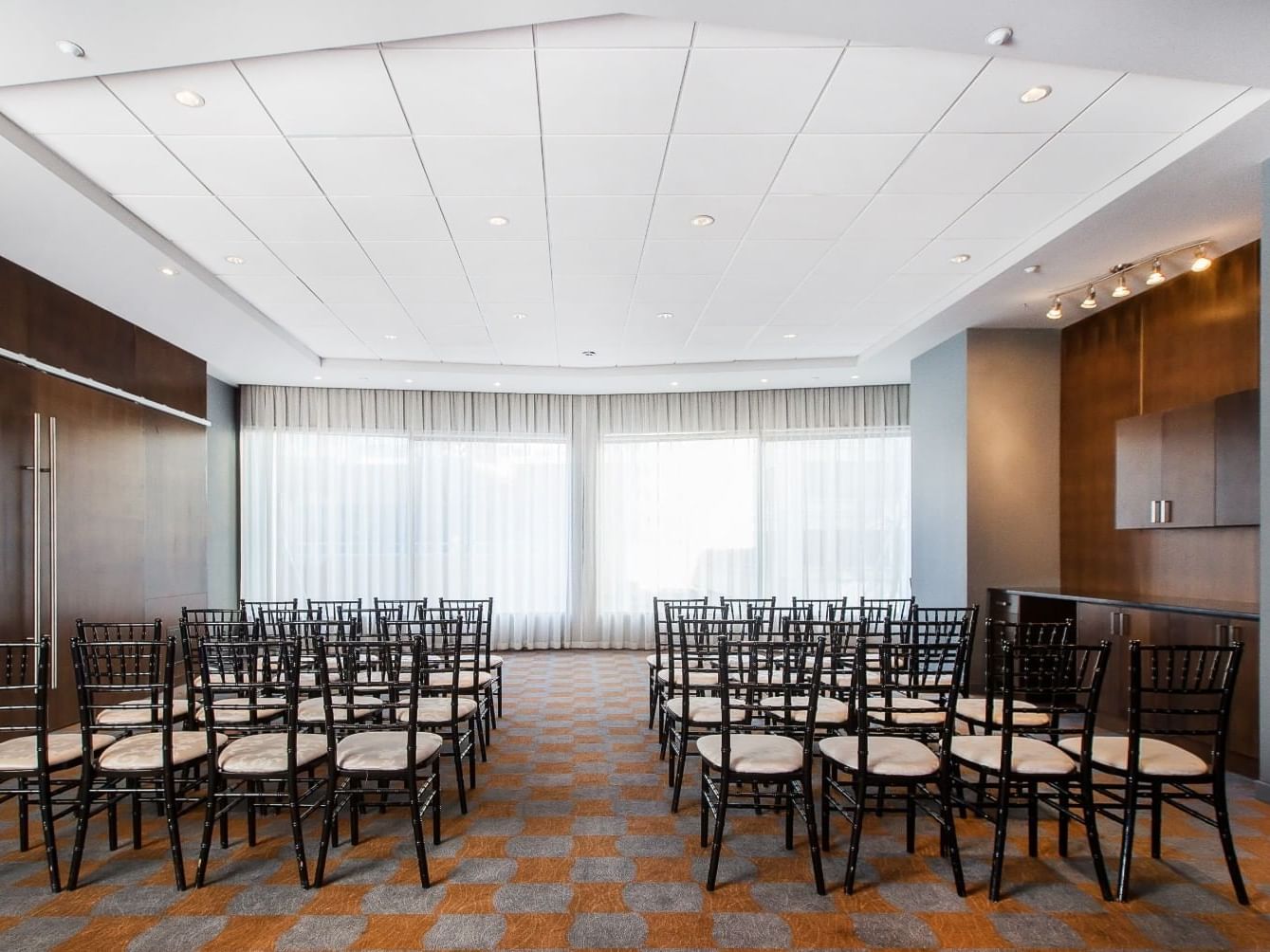 Theatre style Chairs setup in a Prism room at Matrix Hotel