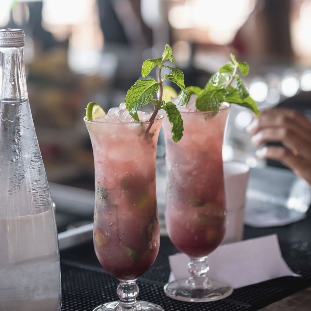 Close-up of cocktails served on a table at Waikiki Resort Hotel by Sono