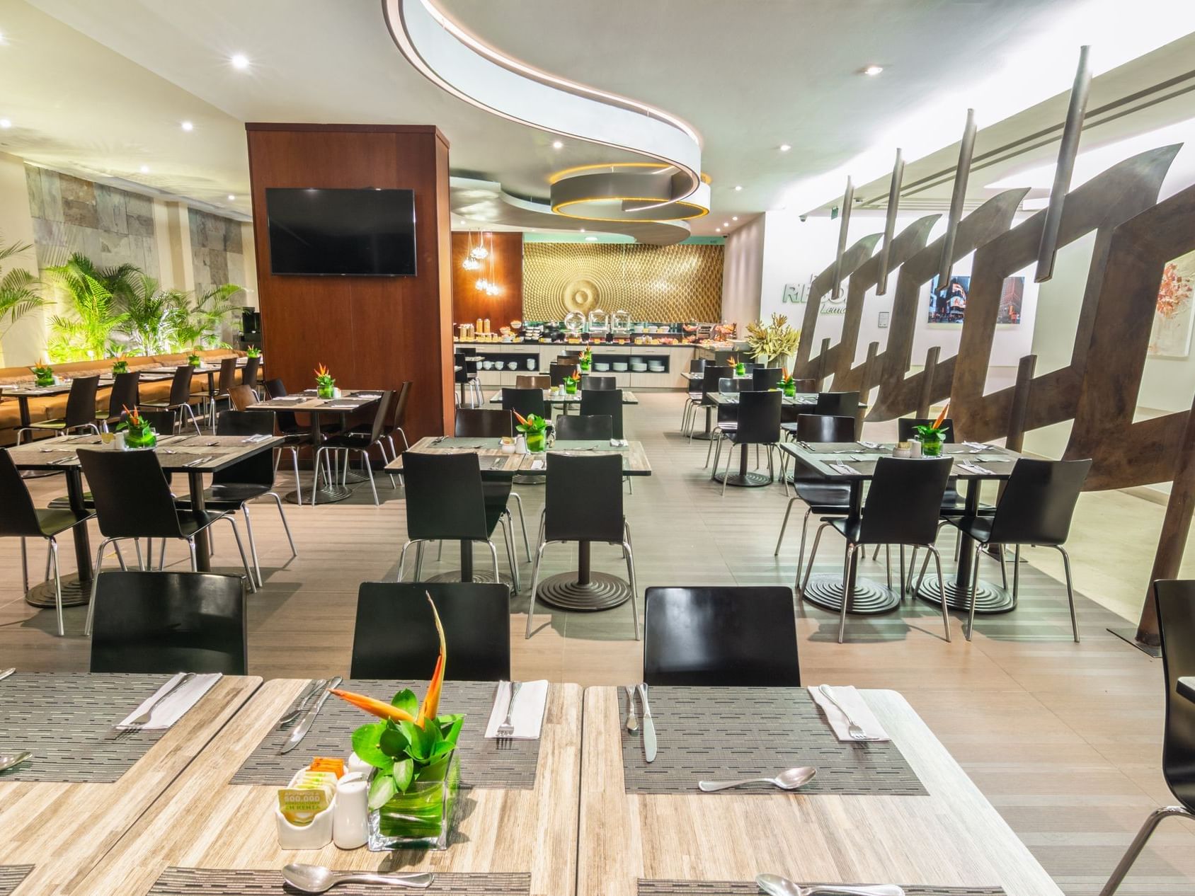 The arranged dining area with tables and chairs