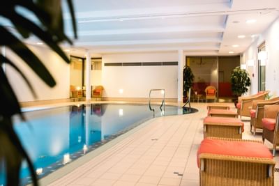 Loungers at indoor pool in Hotel Collegium Leoninum, Bonn