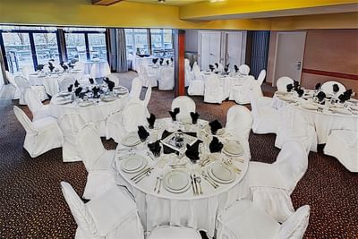 Banquet table setup in the Meeting Room with carpeted floors at Blackstone Mountain Lodge