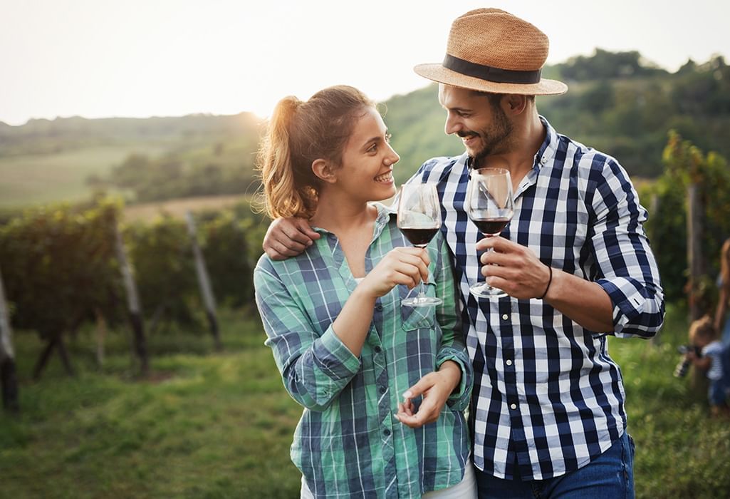 couple wine tasting on a vineyard