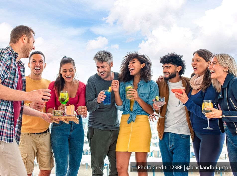 Group of friends celebrates a birthday with refreshing drinks