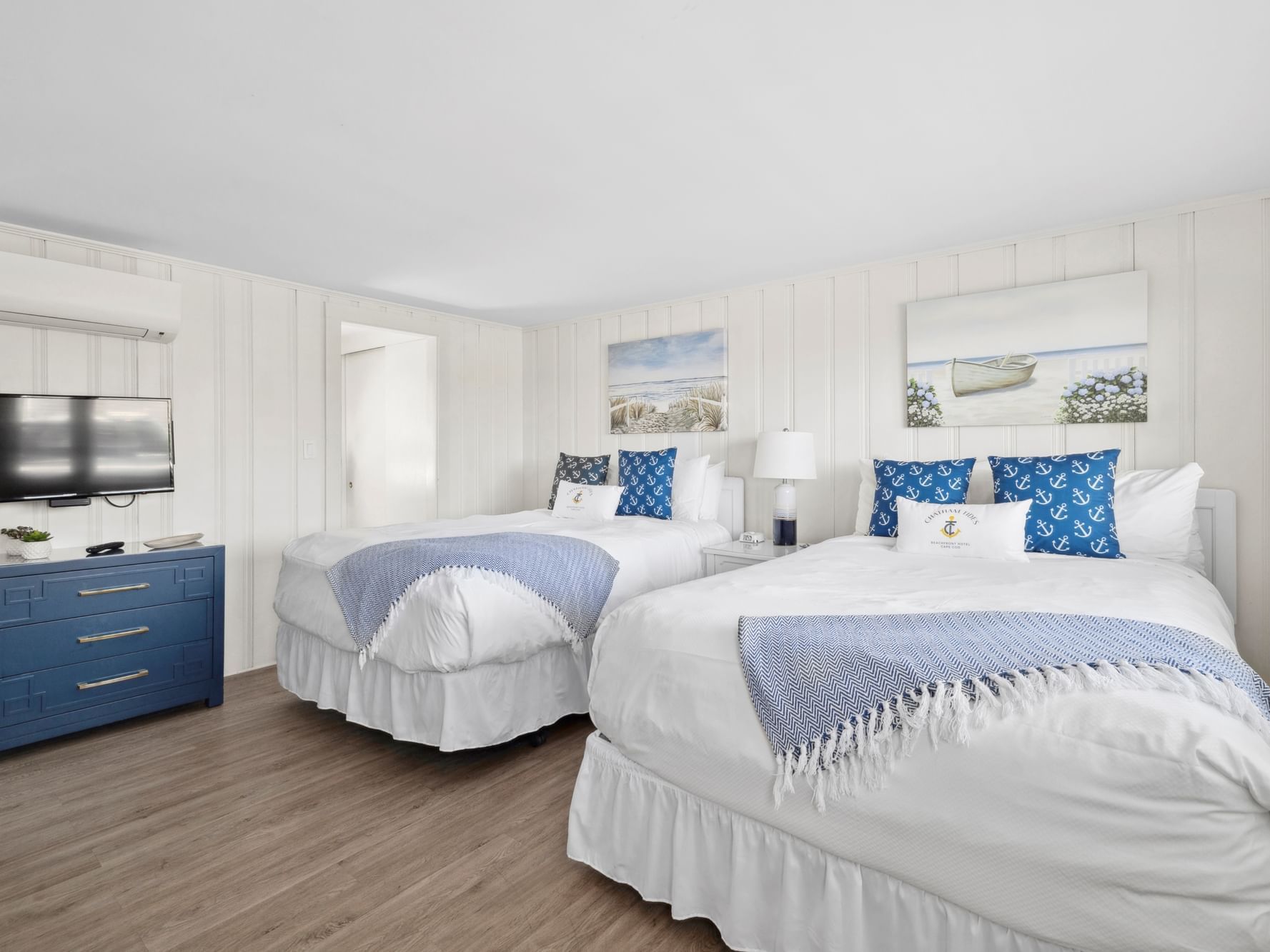Two beds, cresser, and TV in Risingtide Oceanview Double Efficiency at Chatham Tides Resort