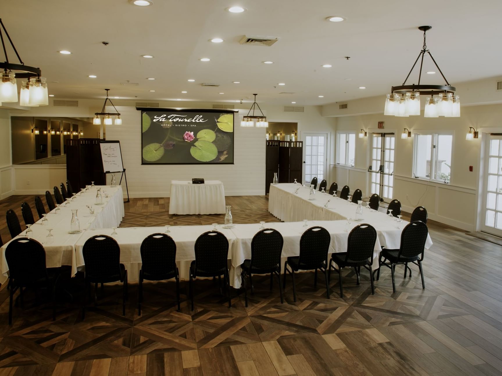 U-shaped meeting table set-up in La Tourelle Banquet Room at La Tourelle Hotel and Spa