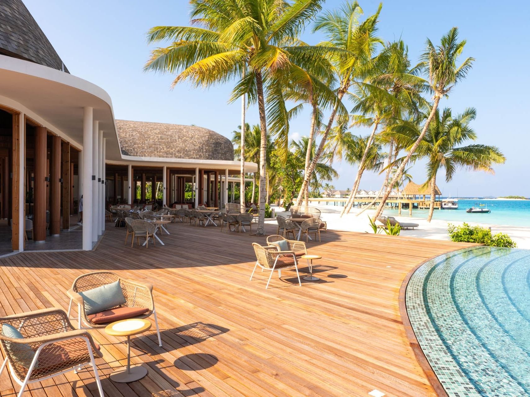 Open dining & lounge area by the pool in The Gallery at Ananea Madivaru Maldives