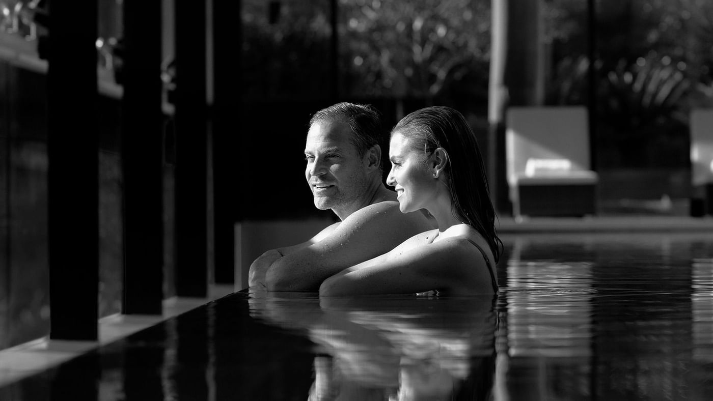 Couple spending time in the pool at Crown Hotels