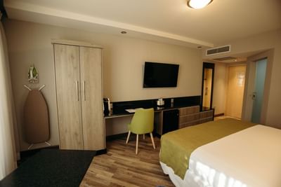 King bed, desk & TV in Master suite at Araiza Hotel Hermosillo