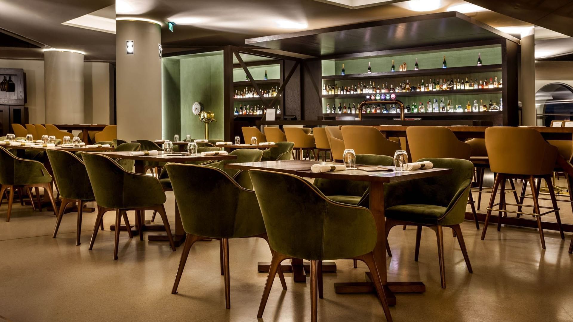 Dining Tables arranged by the bar counter in Vapore Bar at Grand Hotel Açores Atlântico