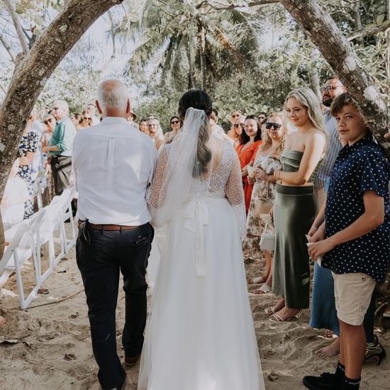 Couple walking through gathering at Pullman Palm Cove Resort