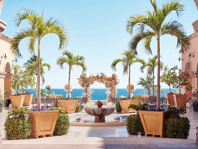Outdoor wedding arrangements overlooking the ocean at Plazuela in Hacienda del Mar Los Cabos