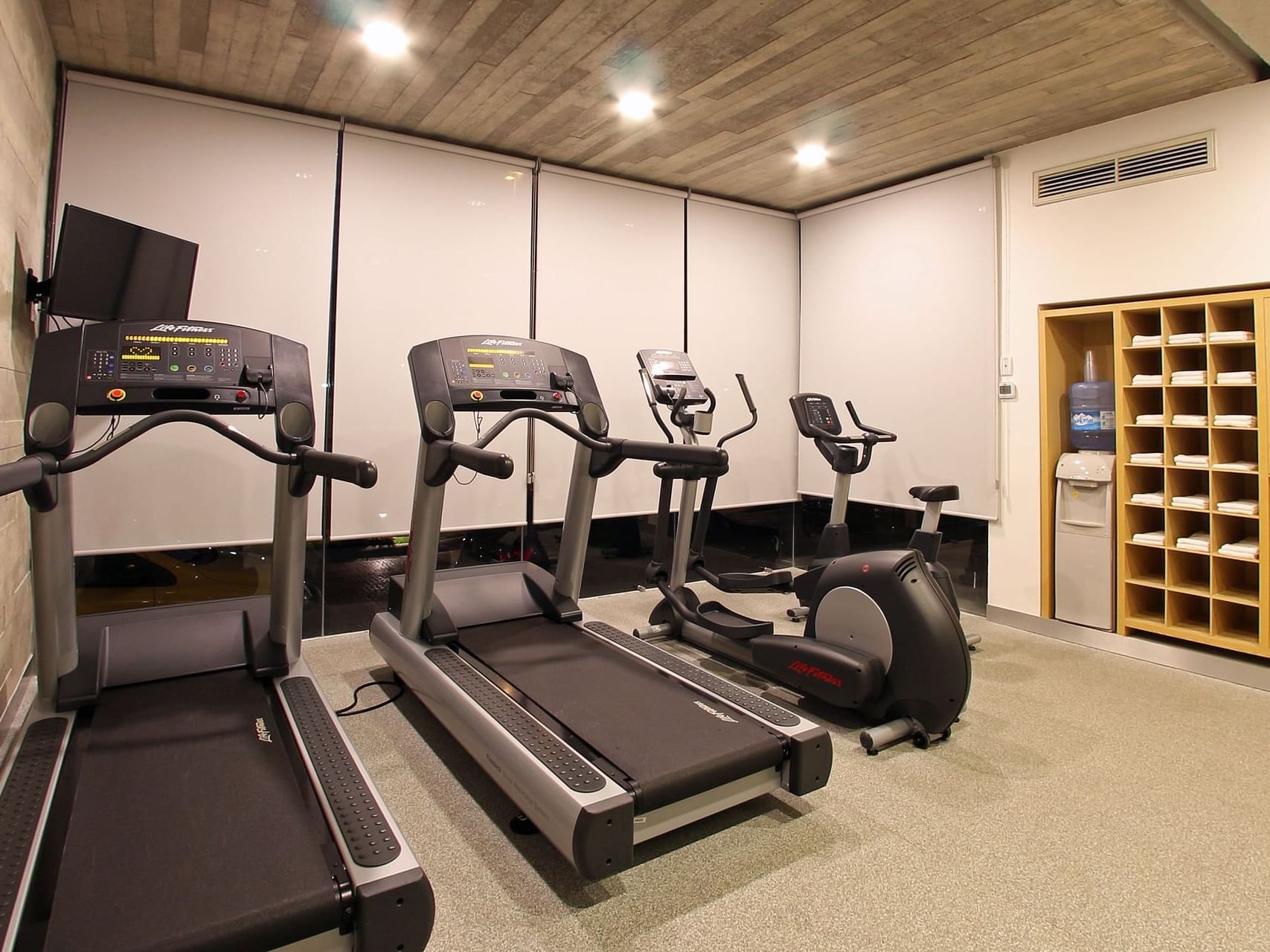 Gym with treadmills & an exercise bicycle at One Hotels