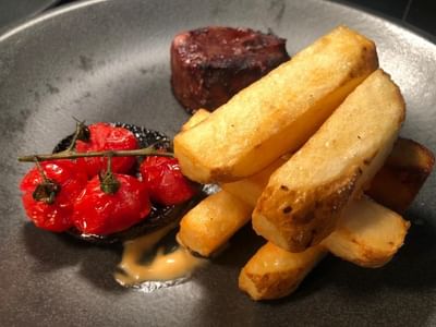 Close-up of French fries with sauce at Orsett Hall Hotel