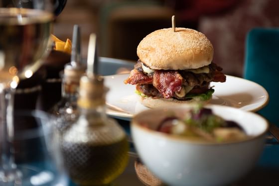 Closeup of an Umami bacon burger served at Richmond Hill Hotel
