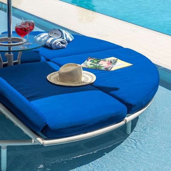 Hat & towels on a sunbed by the pool at Crown Metropol Perth