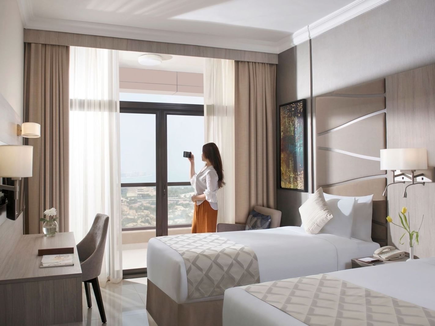Twin beds in Premium Suite City View at 2 Seasons Hotel & Apt