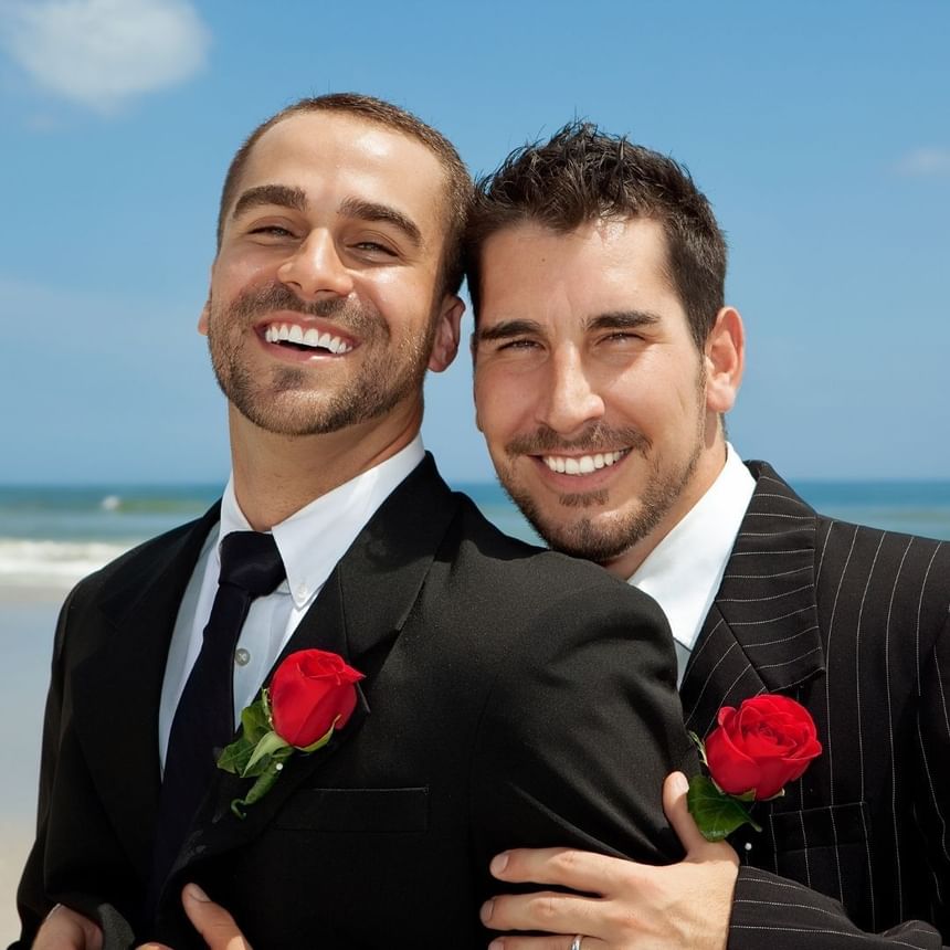 Close-up of two gay grooms at the wedding at Ocean Place Resort