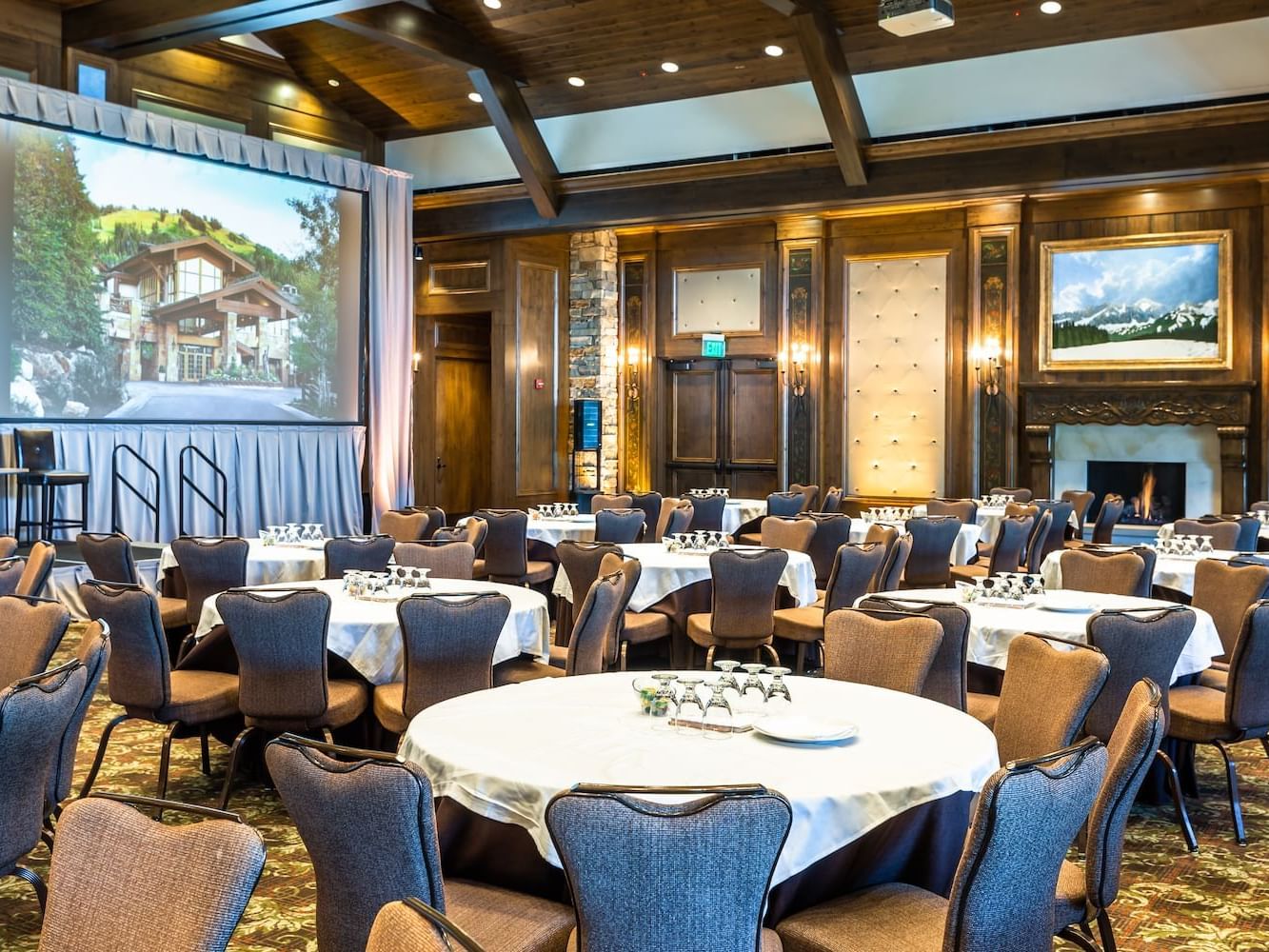 Cabaret set-up with projector screen in Stein Ballroom at Stein Eriksen Lodge