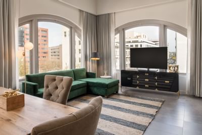 Hi-Lo hotel living area with sofa and media stand