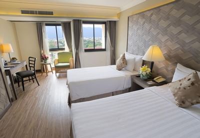 Cozy beds in Deluxe Room Premier at Amora Hotel Chiang Mai