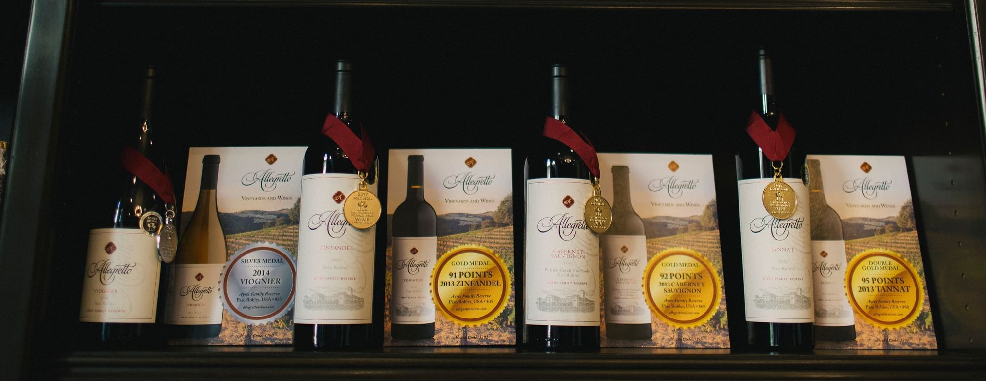 Allegretto wine bottles lined up on shelves