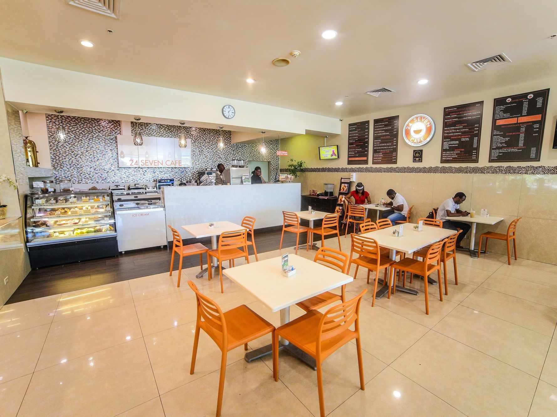 Dining table set-up & counter in 24 Seven Café at Jamaica Pegasus Hotel