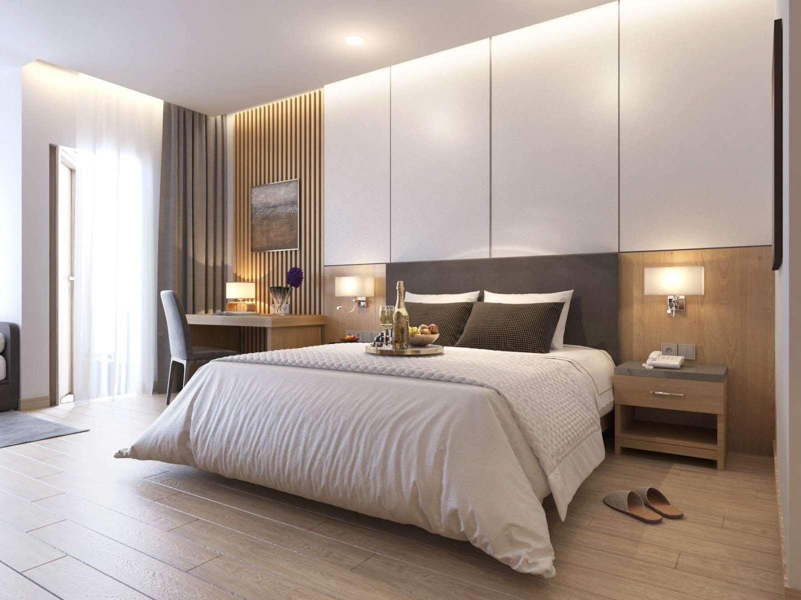 hotel room interior with king bed and modern furnishings