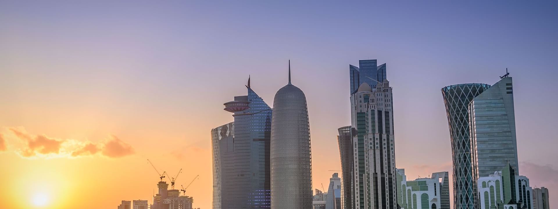 Distant view of Doha city at dawn near Warwick Doha