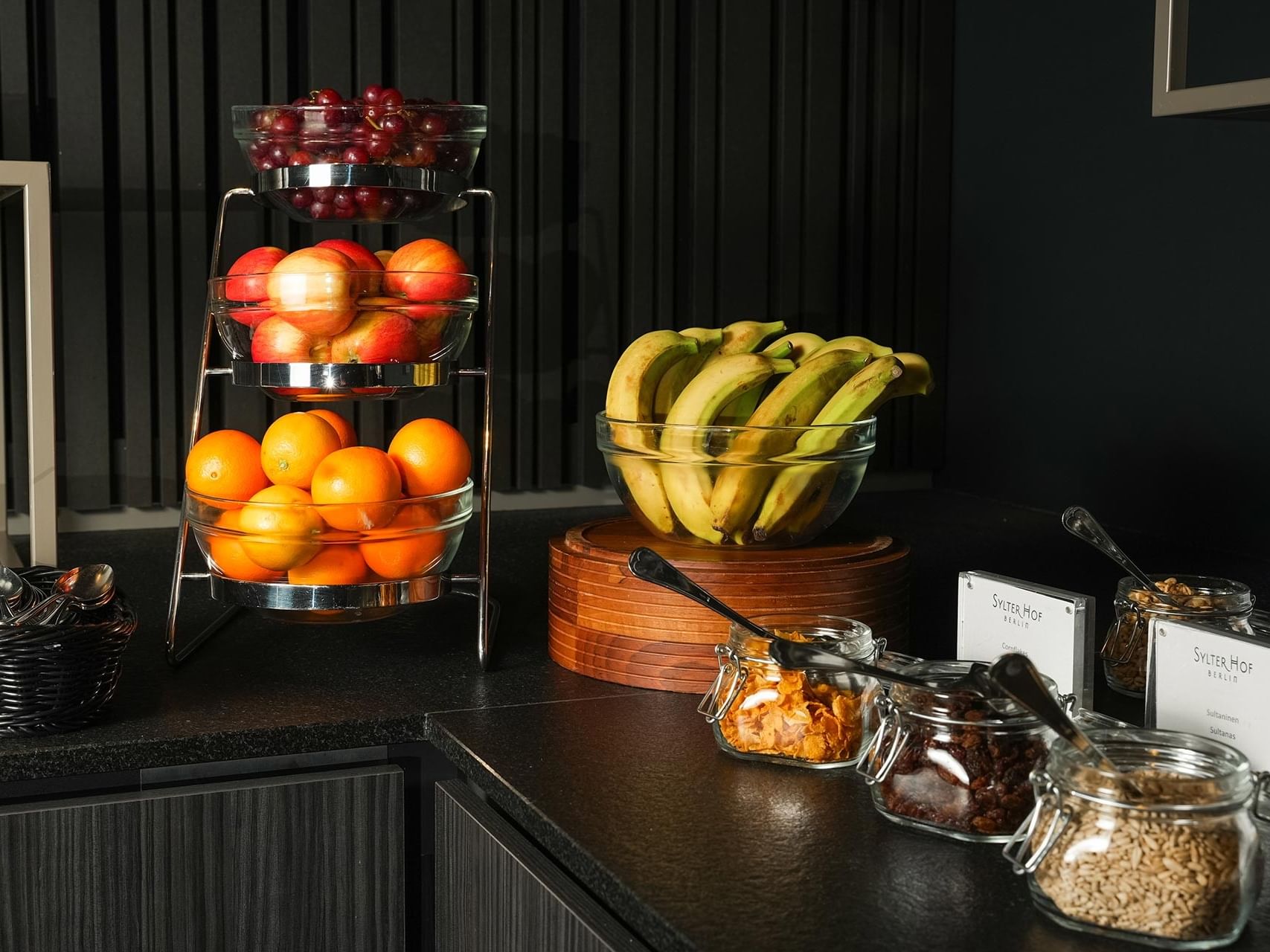 Fresh fruits and snacks arranged on a countertop at Sylter Hof Berlin.