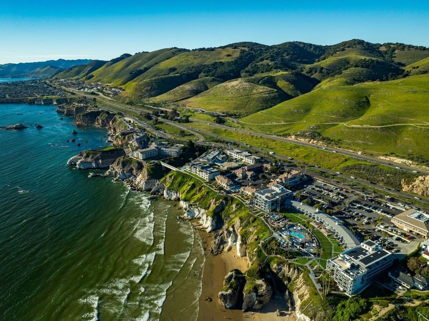 Aerial view of Pismo bluffs with hotels and Pismo Preserve 