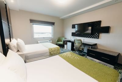 Two Double beds facing a TV in Standard Room at Araiza San Luis