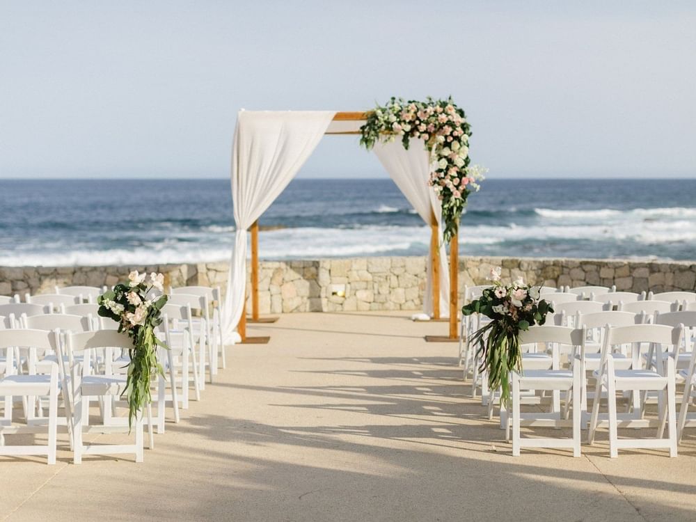 Outdoor Wedding set-up by the sea at Curamoria Collection