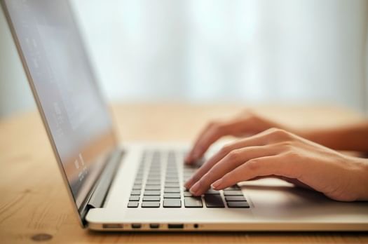 Close up of person working on laptop at Imperial Lexis Kuala Lumpur