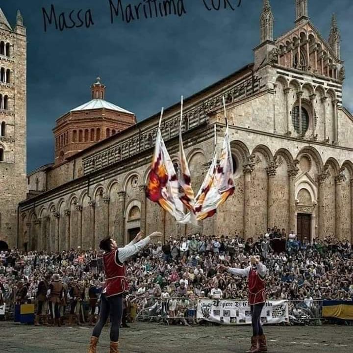 Crowd gathered in Massa Marittima for a crossbow competition near Golf Hotel Punta Ala