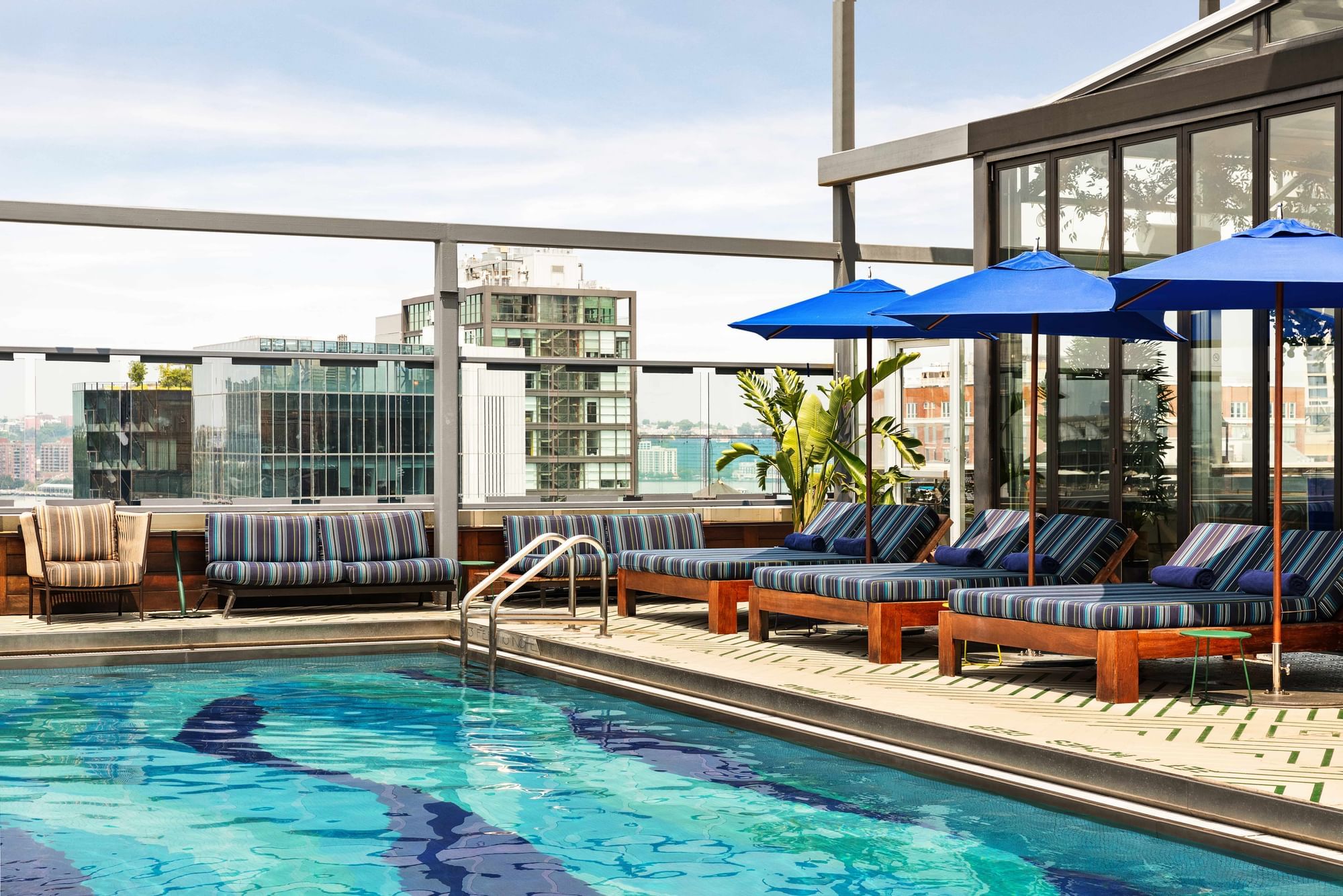 Rooftop pool with city view in the background