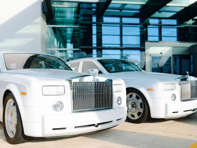 Two Rolls Royce parked near the entrance at Live Aqua Resorts