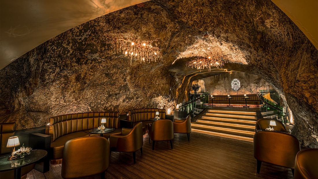 JEFF'S CELLAR BAR interior with stone walls and chandeliers at The Banjaran Hotsprings Retreat in Ipoh.